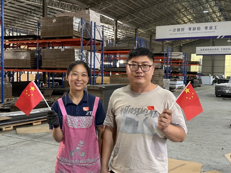 Factory colleagues in the warehouse area.
